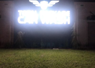 Total Package Car Wash sign at night