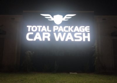 Total Package Car Wash sign at night