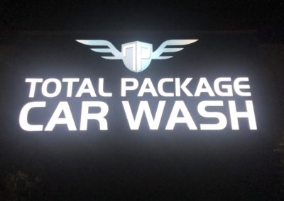 Total Package Car Wash logo on black